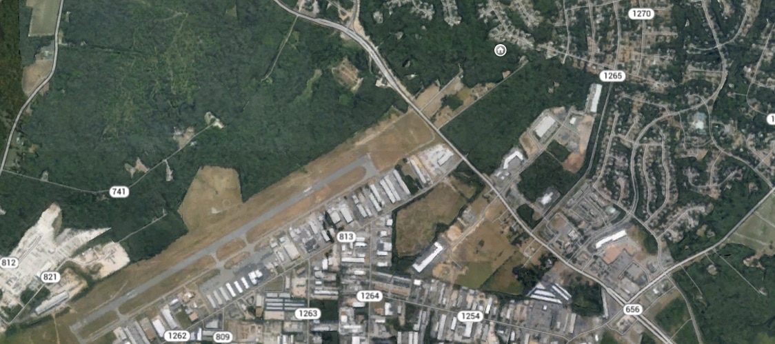 The local county airport is hidden from view but can impact enjoyment of the lots in its flightpath